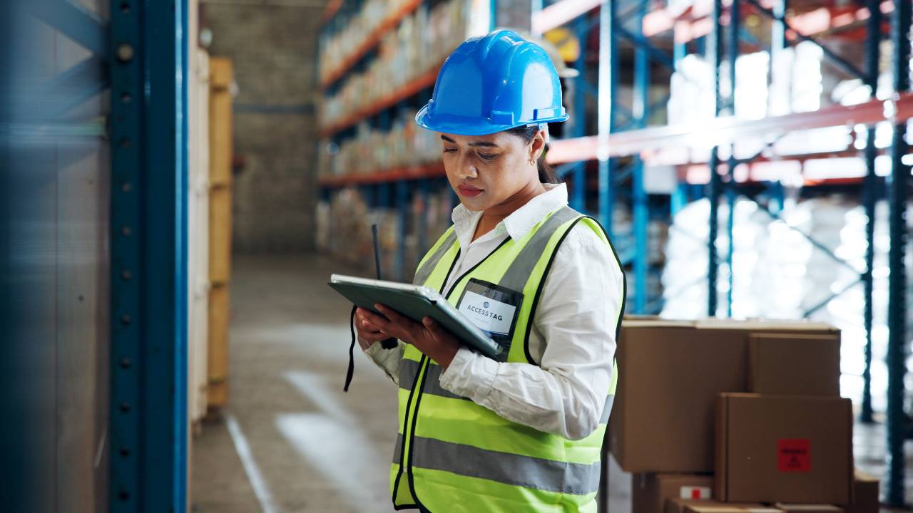 Tablet, logistics worker and woman in warehouse for distribution, supply chain or check stock